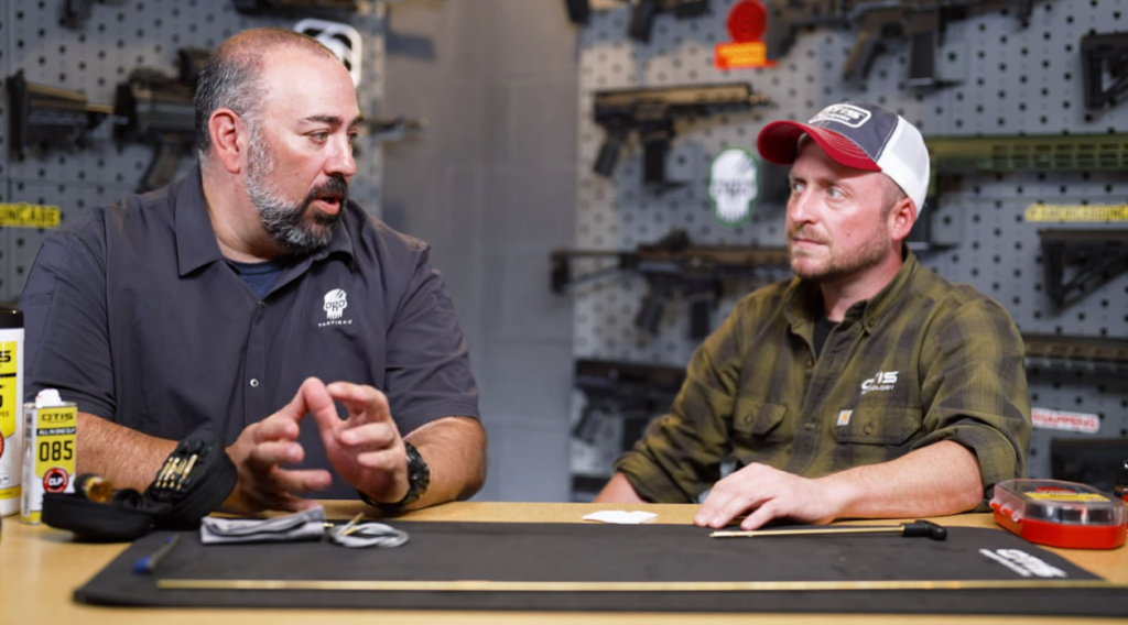 two man talking in a gun store